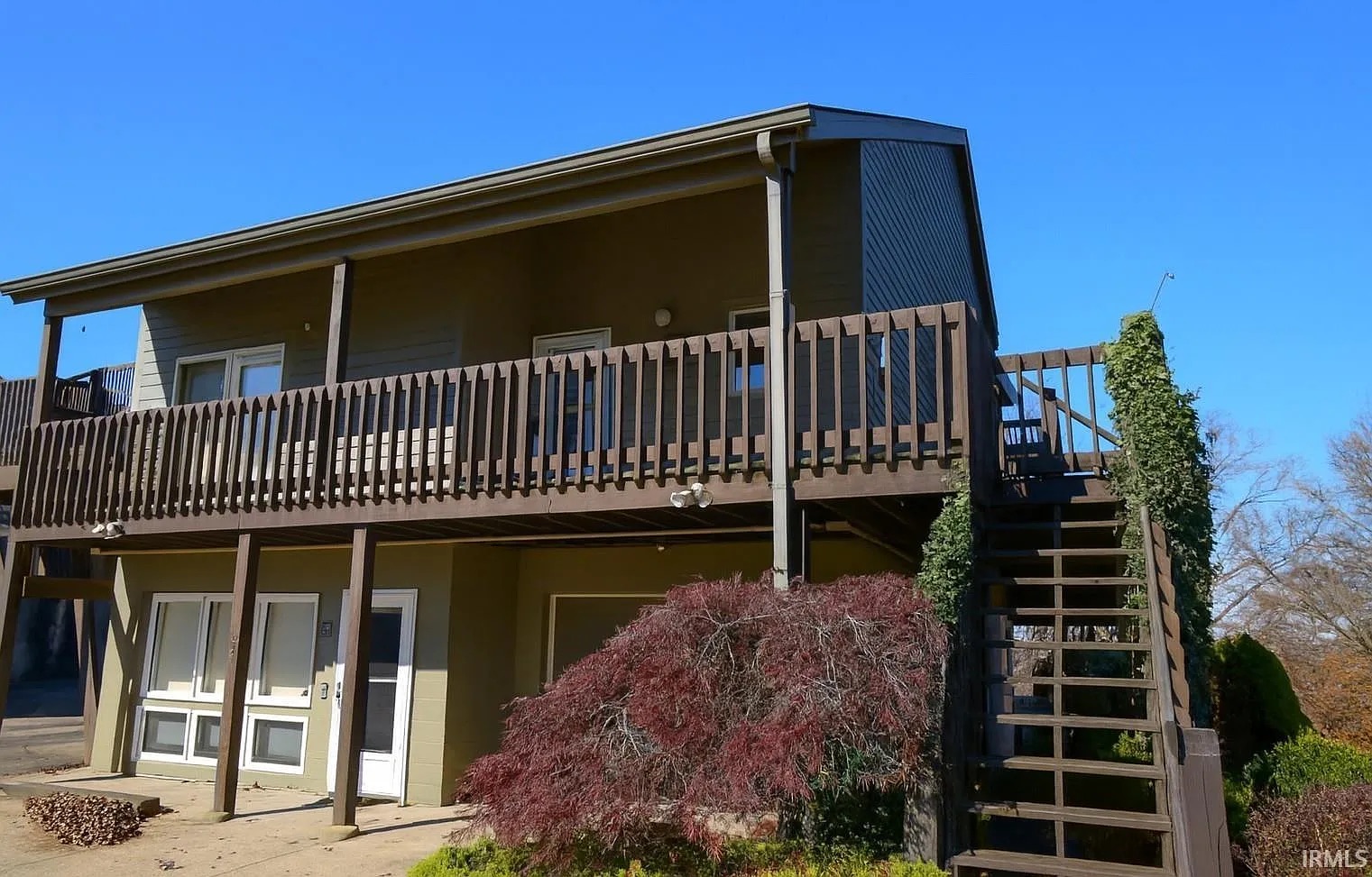 Garage side of Harbour Pointe #53 showing the deck stairs