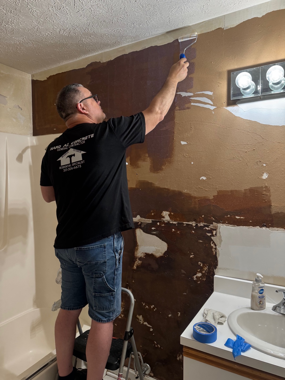 Joe repairing the bathroom walls