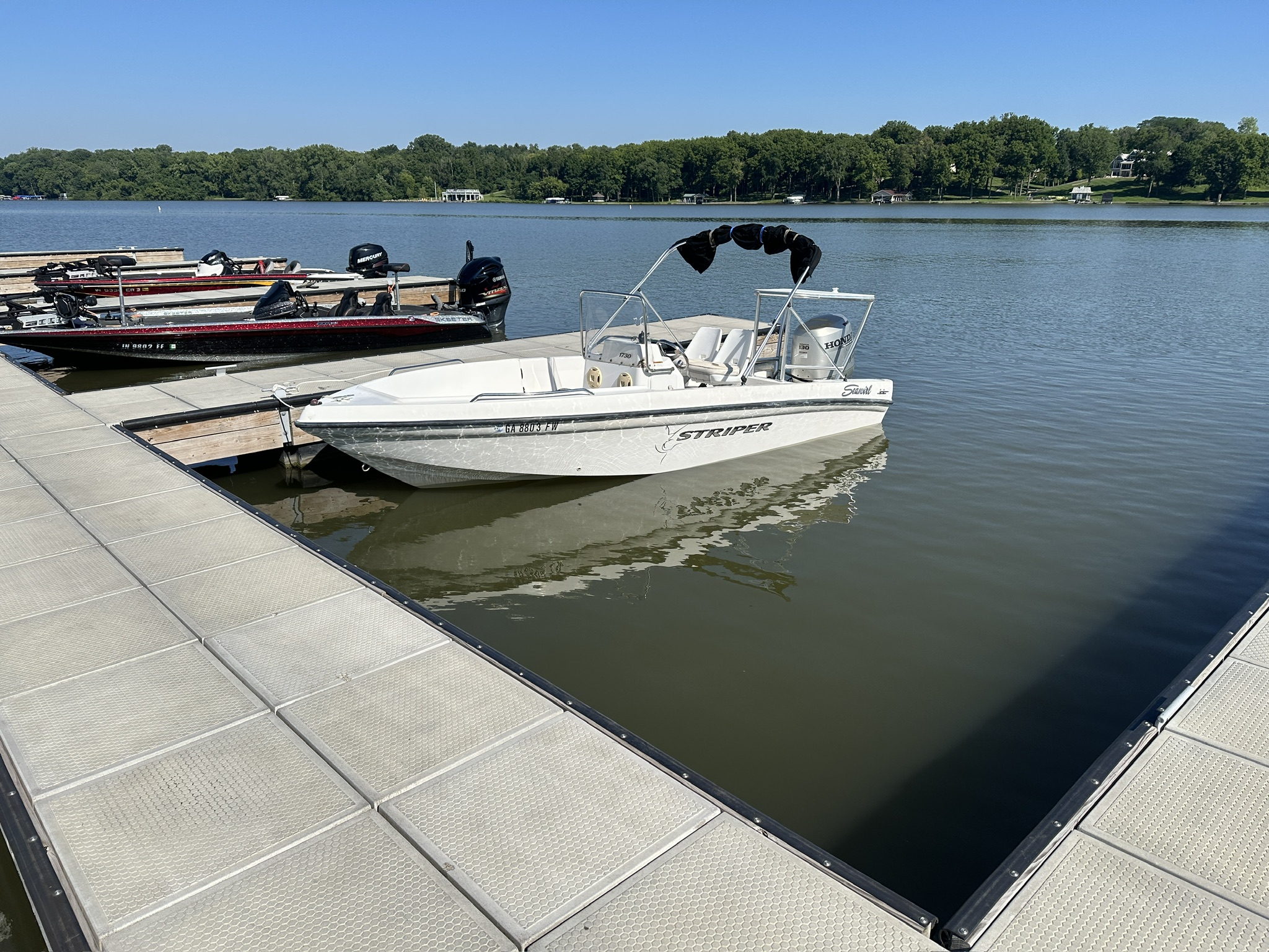 The SeaSwirl Striper tied to a dock on Lake Monroe after its Honda 130 powerhead replacement
