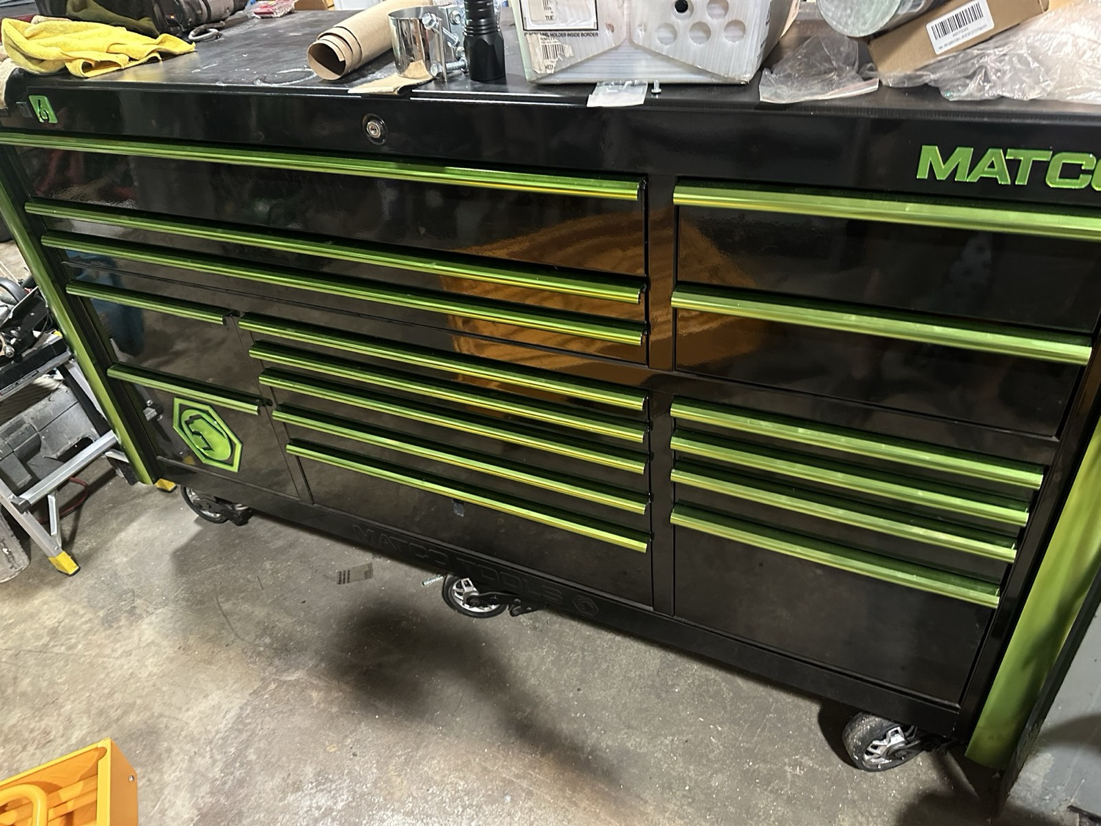 A large black and green Matco professional toolbox in Eric's shop