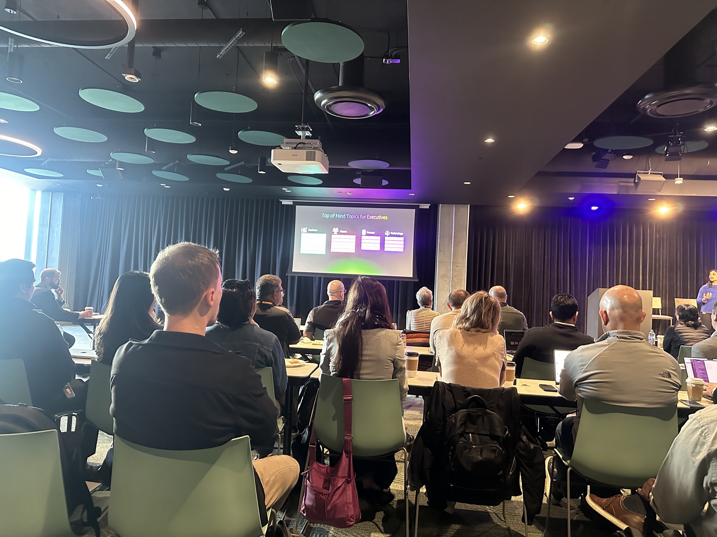 People attending a professional presentation in a conference room