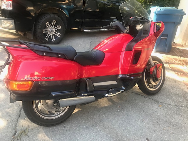 A 1996 Honda Pacific Coast motorcycle awaiting repairs
